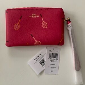 COPY - Pink bracket print wristlet Coach